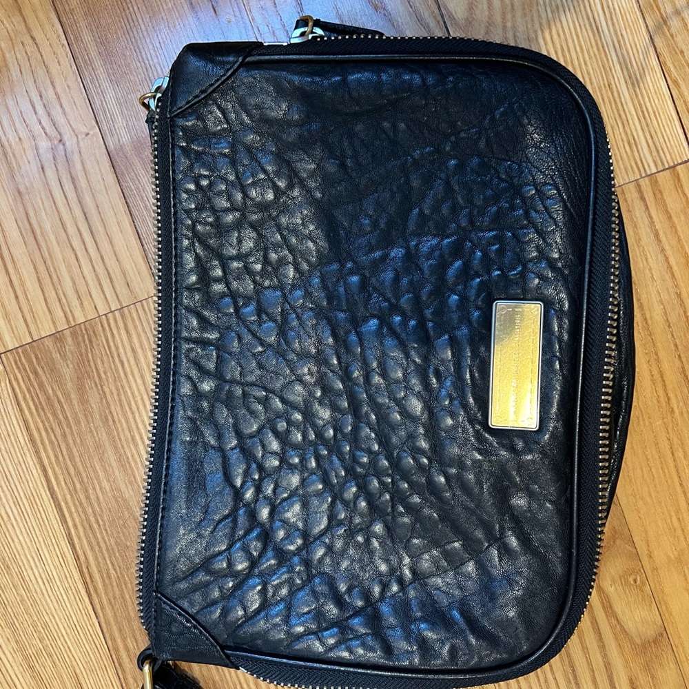 Black Leather Clutch Bag with Zipper Closure and Textured Surface